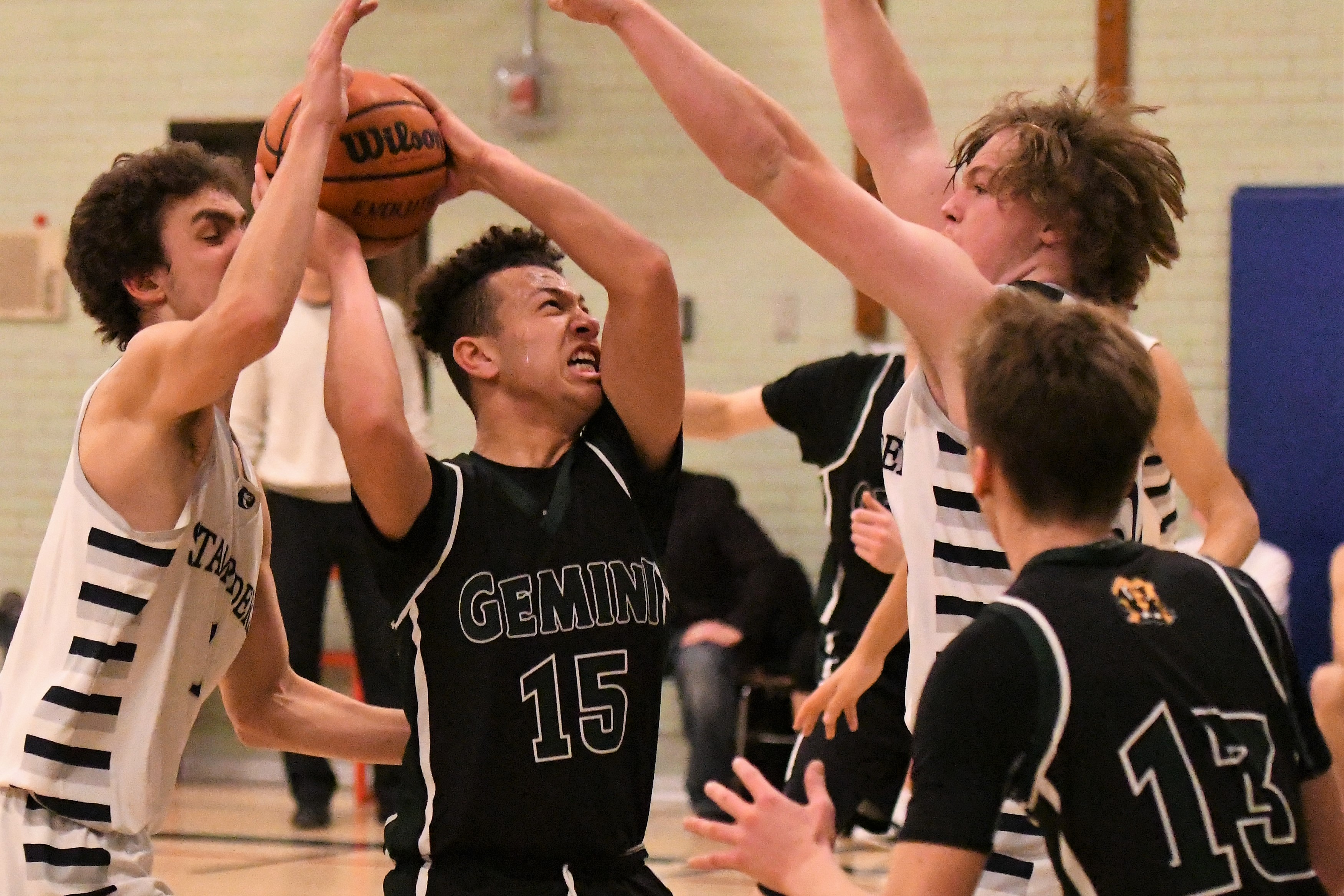 senior boys basketball action