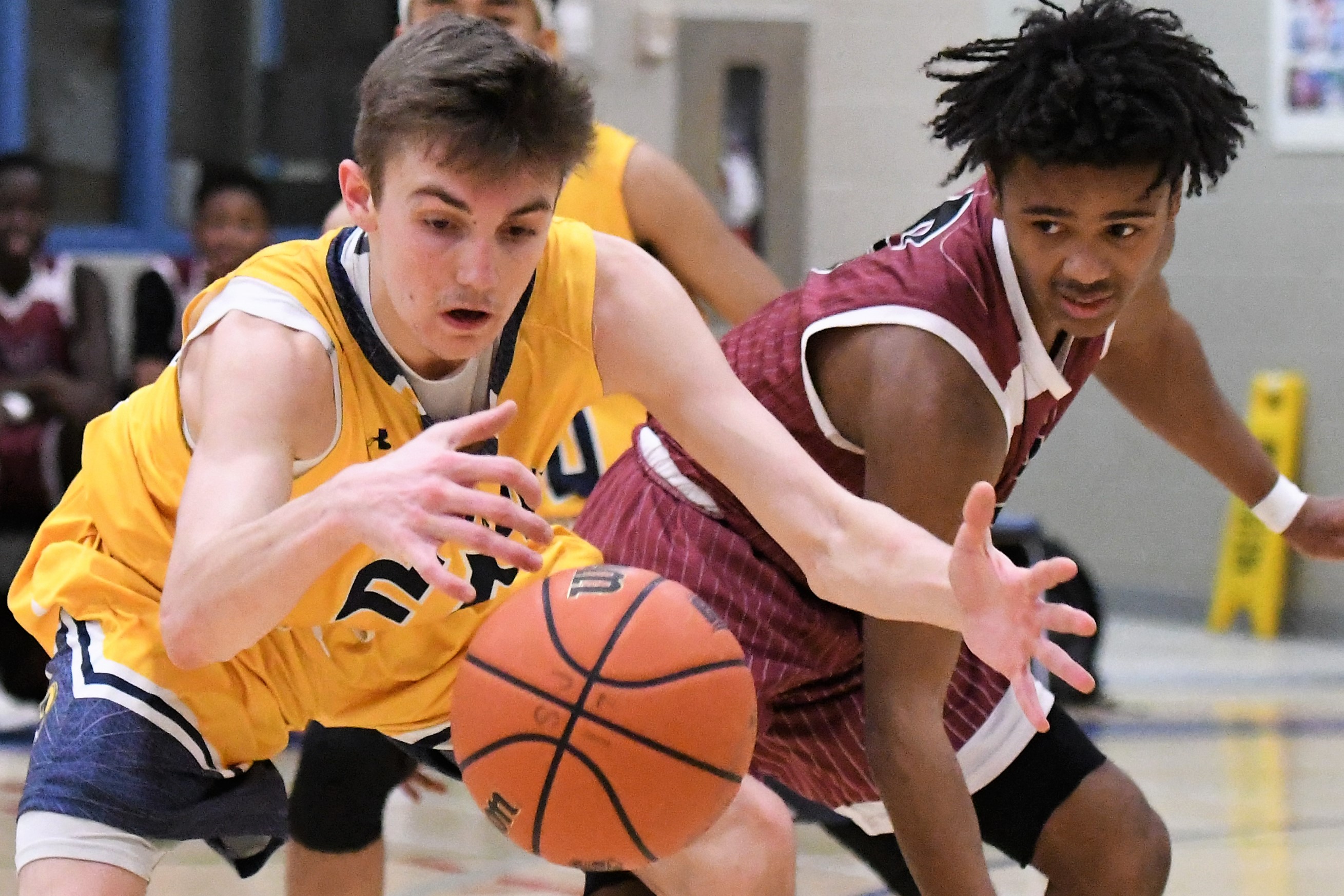 senior boys basketball action