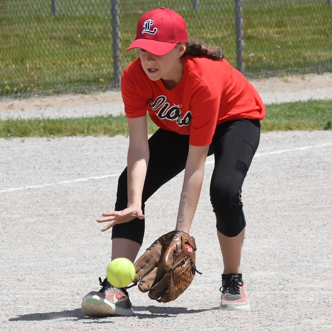 Arthur scoops up ball