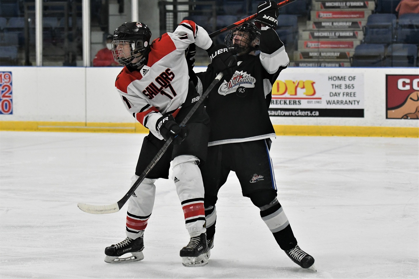 Port Stanley Sailor Lucas Glanville (17) and Dorchester Dolphins Ethan Whitmore battle for positioning during Provincial Junior Hockey at Dorchester. The Dolphins won 4-1. <i> (photo / Rob J. Ross) </i> action