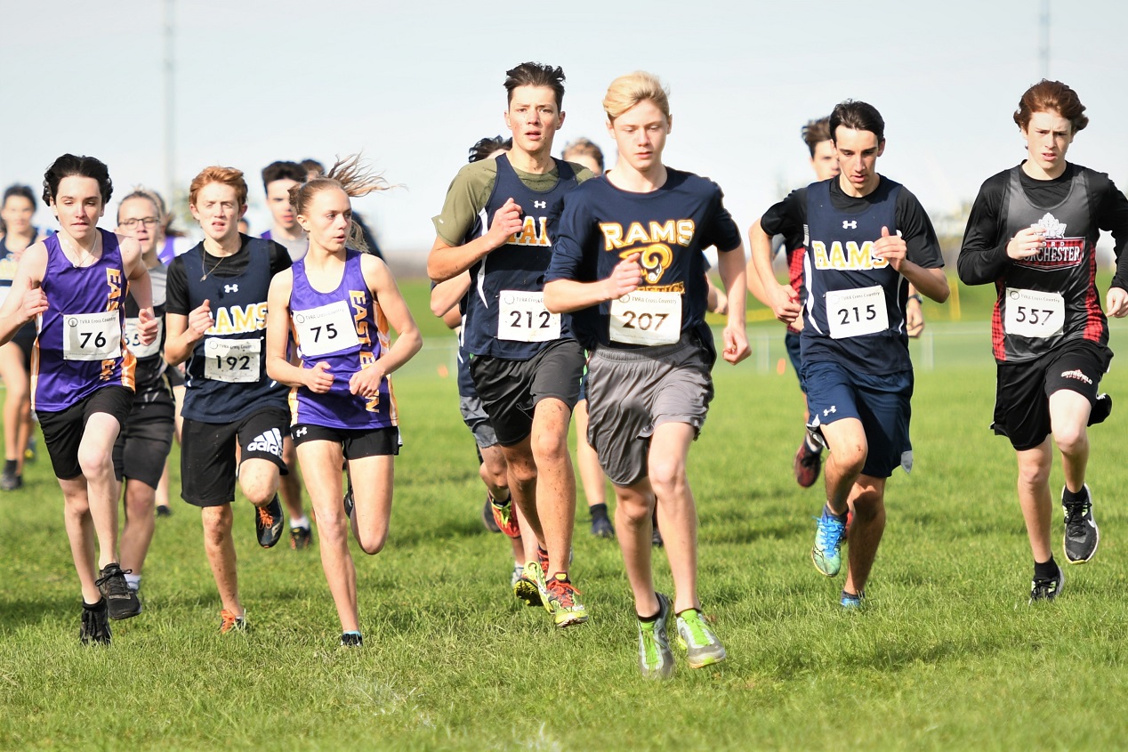 St. Joseph's Ram Jayden McMullen (207) leads the way early in the junior four kilometre race, at the TVRA Tricounty cross country championships at Strathroy. <i> (photo / Rob J. Ross) </i> action